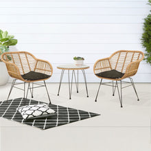 ATRANI two wicker chairs with black cushions and a small round table on a white floor - DECOR STAR
