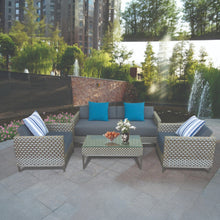BENTLEIGH outdoor patio set with a sofa, chairs, and table on a paved area - DECOR STAR