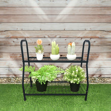 BAYSIDE 2-tier black metal plant stand with potted plants against a wooden wall - DECOR STAR