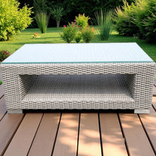 CANTERBURY wicker outdoor coffee table with a glass top on a wooden deck - DECOR STAR