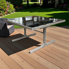 CARLTON Outdoor patio table with glass top on a wooden deck - DECOR STAR