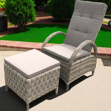 CARNEGIE wicker recliner chair and ottoman set with gray cushions on a patio - DECOR STAR