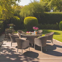 CLIFTON HILL Outdoor patio setting with wicker stacking chairs and a round table on a wooden deck - DECOR STAR