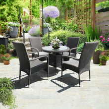 Niddrie Outdoor patio set with four chairs and a table in a garden setting - DECOR STAR