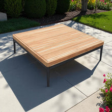 Wooden outdoor table on a patio - DECOR STAR