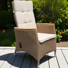 GLEN WAVERLEY wicker recliner chair with beige cushions on a wooden deck - DECOR STAR