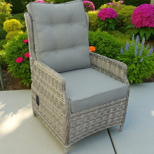 KINGVILLE wicker recliner armchair with grey cushions on a patio - DECOR STAR