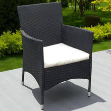 Dark wicker knocked-down armchair with a white cushion on a patio - DECOR STAR