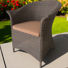 MORDIALLOC PE wicker chair with a colour cushion on a patio - DECOR STAR