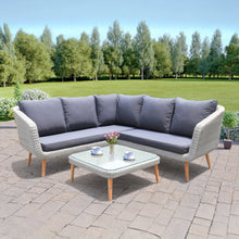 MITCHAM outdoor patio corner set with sectional sofa and coffee table on a paved area - DECOR STAR