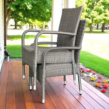 NIDDRIE two grey wicker stackable chairs on a wooden deck - DECOR STAR