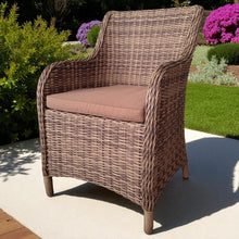 OAKLEIGH wicker chair with a cushion on a patio area - DECOR STAR