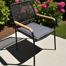 PARKDALE Black round cording chair with wooden armrests and grey cushion on a patio - DECOR STAR