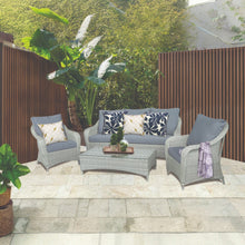 PRAHRAN 5-seater outdoor patio set with grey chairs and a coffee table on a stone patio - DECOR STAR