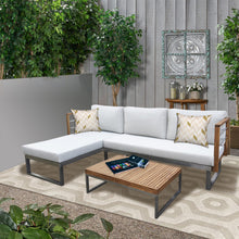 SANDRINGHAM outdoor patio set with sectional sofa with timber coffee table in a garden setting - DECOR STAR