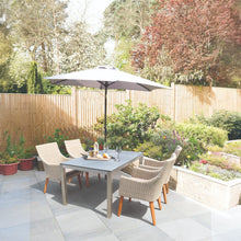 SOUTHBANK outdoor patio dining set with metal frame table, chairs in a garden setting - DECOR STAR