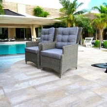 Two PE wicker chairs with blue cushions by a poolside - DECOR STAR