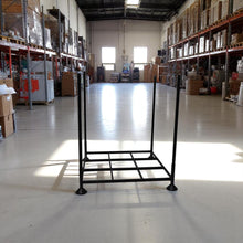 Black stackable stillage cage in a warehouse setting - DECOR STAR
