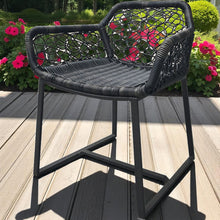 WARNTINA Black wicker high chair on a wooden deck - DECOR STAR