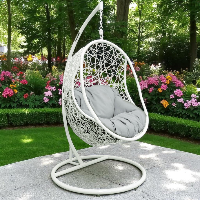 WILLIAMTOWN white egg-shape hanging chair with gray cushion in a garden setting - DECOR STAR