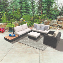 WINDSOR outdoor patio set with sectional sofa, ottoman, and side table on a patio - DECOR STAR